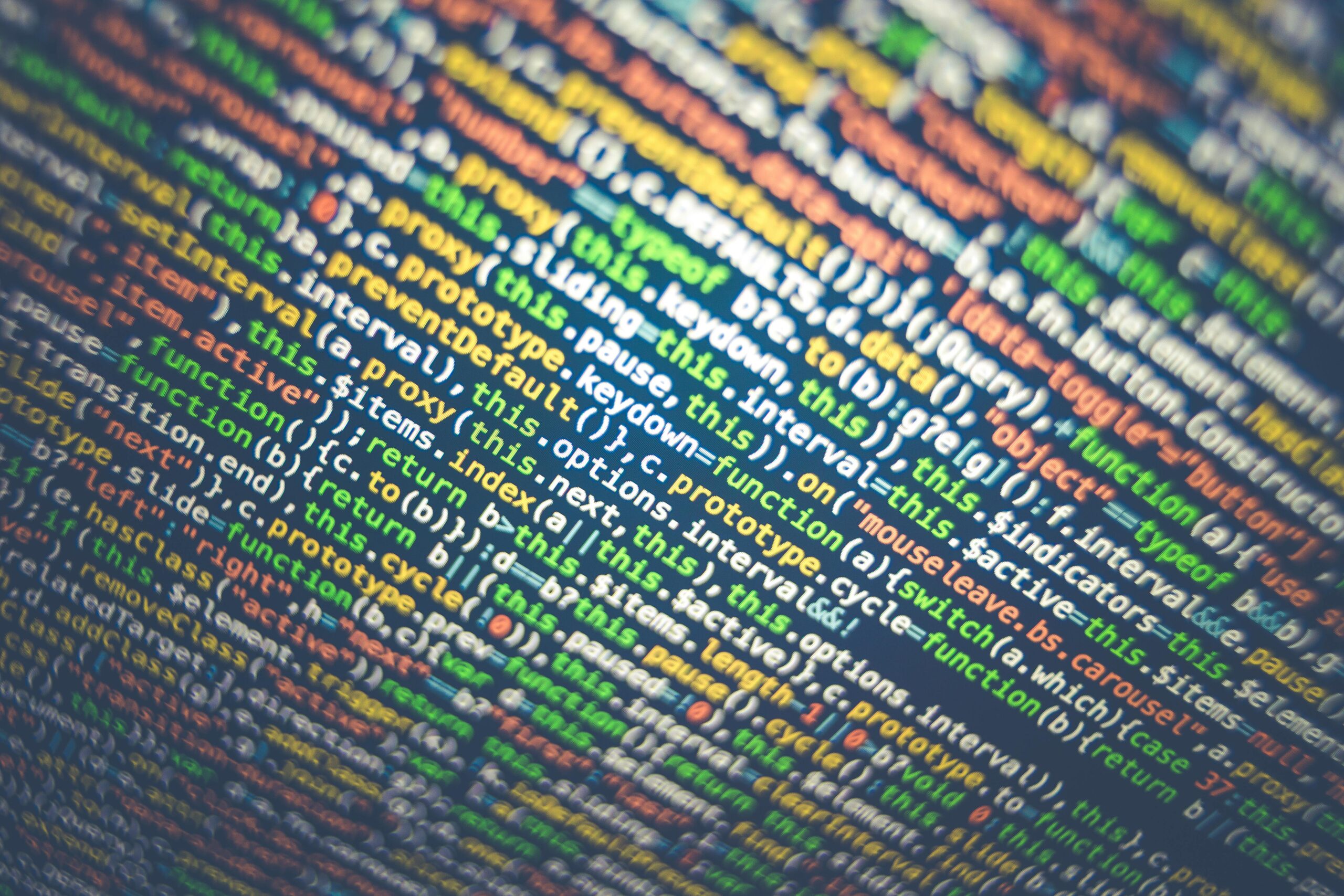Vibrant multicolored source code displayed on a computer screen, depicting programming and web development concepts.